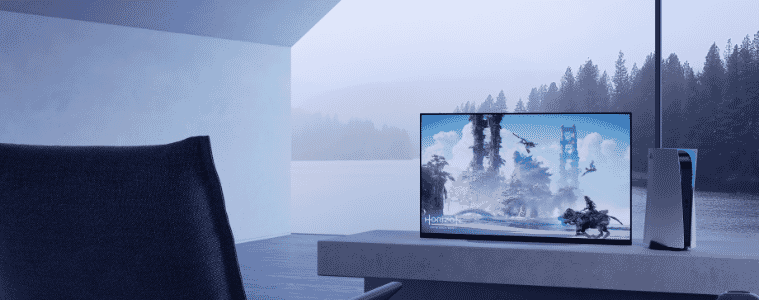 The Sony XR BRAVIA A90K OLED 4K Google TV set up with a Playstation 5 in a beautiful lakeside room
