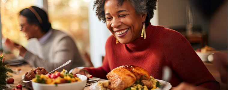 Happy woman at dining table during family dinner.