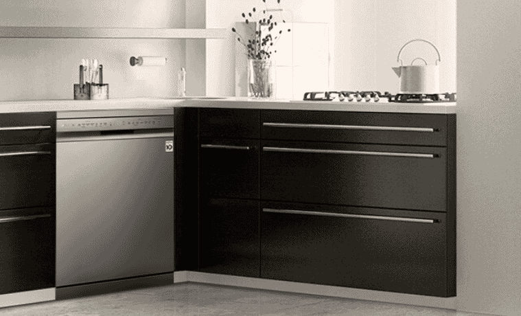 A kitchen with sleek black cabinetry and an LG QuadWash dishwasher