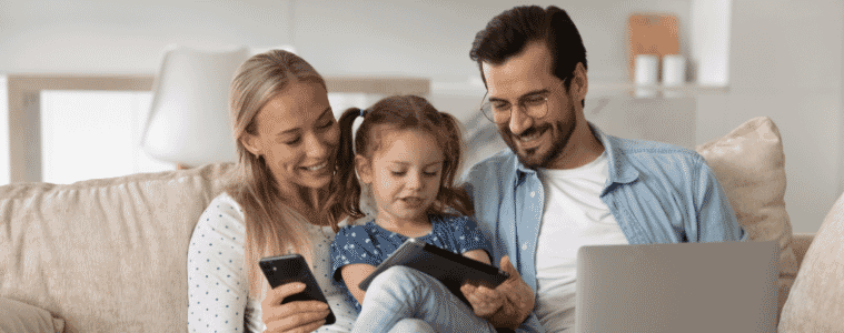 a family sitting down using tech together 