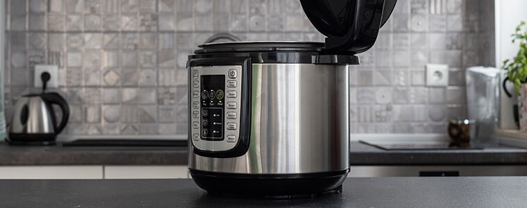 Modern multi cooker in a kitchen, open and ready to cook.