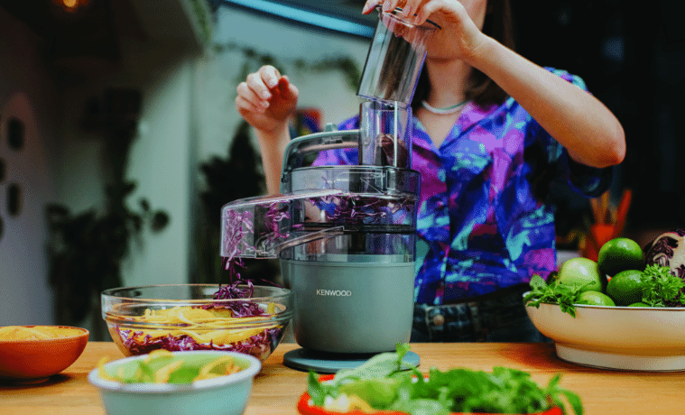 a woman using the Kenwood MultiPro Go Food Processor to prepare food for a party 