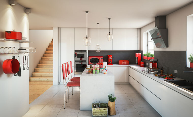 a white kitchen with red kitchen appliances 