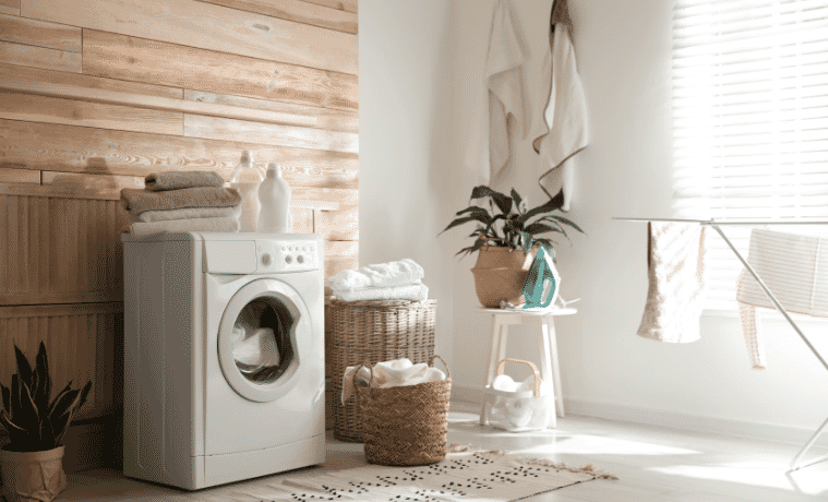 Stylish laundry room interior with modern washing machine.