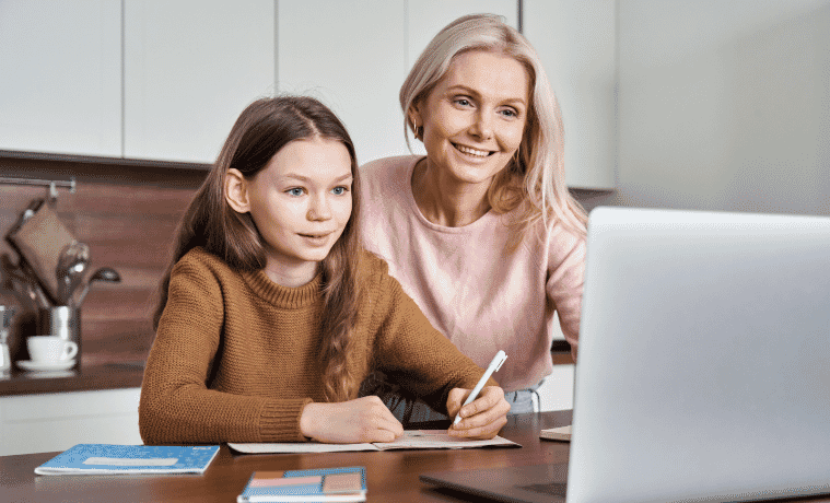A mum helping her daughter with her school homework 