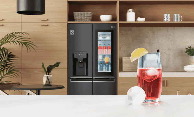 LG Instaview Fridge in a modern kitchen with a summer drink made from LG Craft Ice Feature