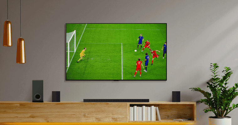 Image of LG TV in living room displaying a soccer game.